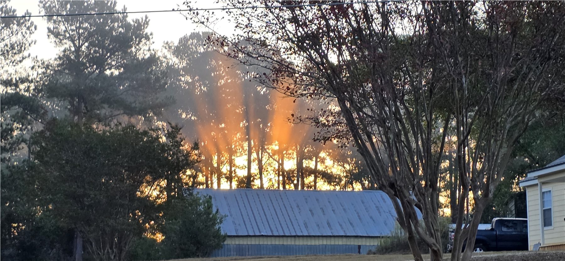 Sunbeams above the barn