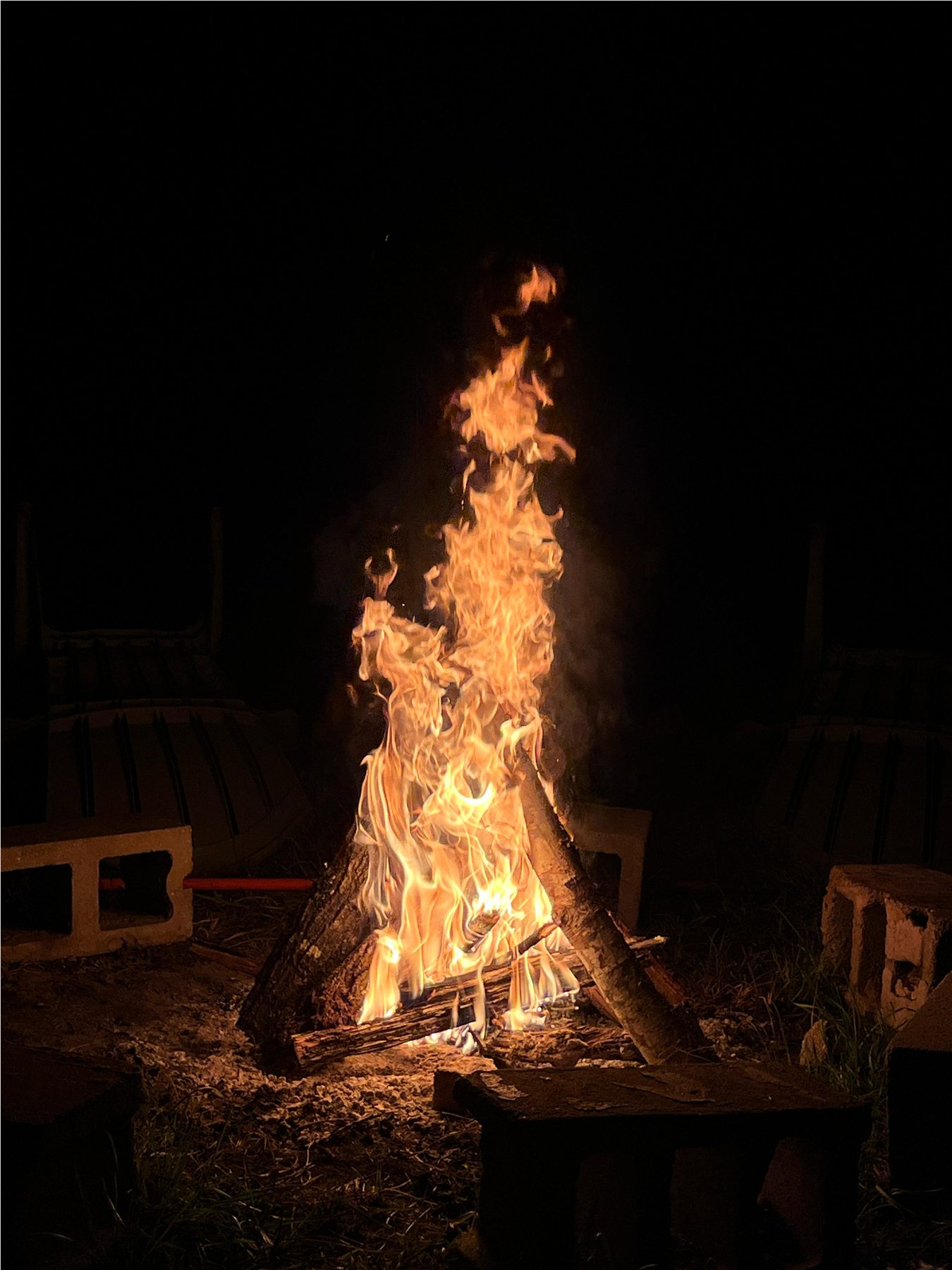 Tall fire in the outdoor gathering ring